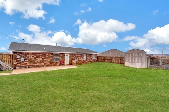 view of yard featuring a patio area and a storage unit