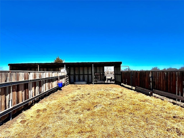 view of yard with an exterior structure and an outdoor structure