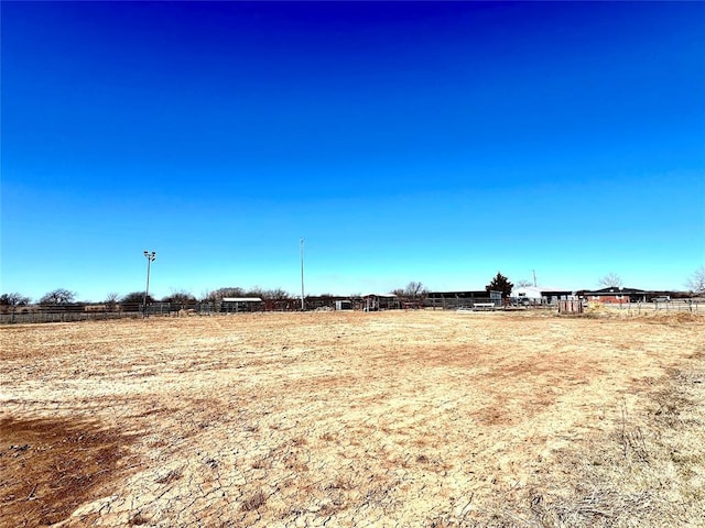 view of yard with a rural view