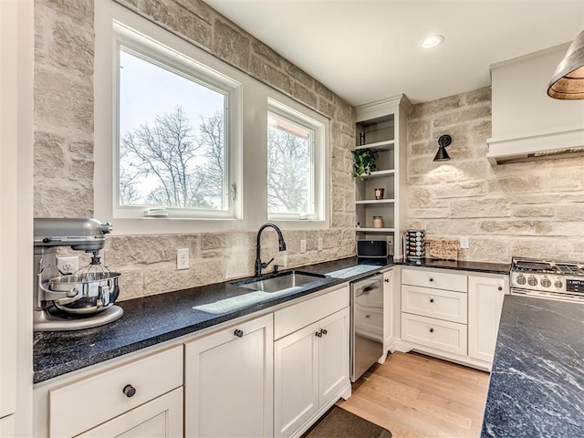 kitchen with a sink, white cabinets, appliances with stainless steel finishes, light wood-type flooring, and open shelves