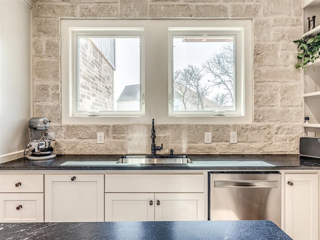 kitchen with open shelves, a sink, and white cabinetry