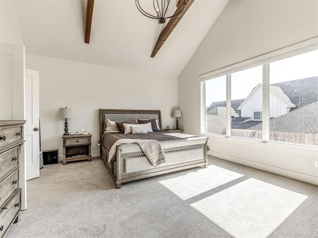 bedroom with light carpet and lofted ceiling with beams