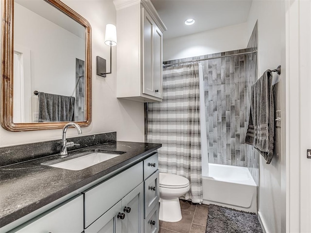 bathroom with toilet, tile patterned floors, shower / bath combination with curtain, and vanity