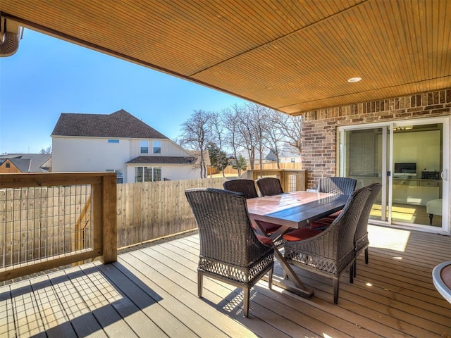 wooden deck featuring outdoor dining area