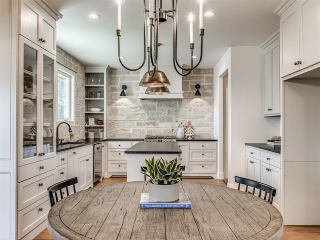 7308 Sunset Sail Ave, Edmond, OK 73034 - kitchen featuring a sink, backsplash, dark countertops, and dishwasher