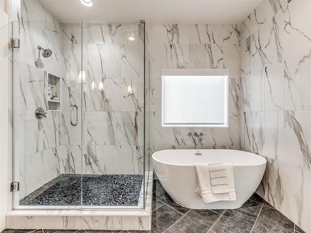 7308 Sunset Sail Ave, Edmond, OK 73034 - full bath with a soaking tub, tile walls, a marble finish shower, and marble finish floor