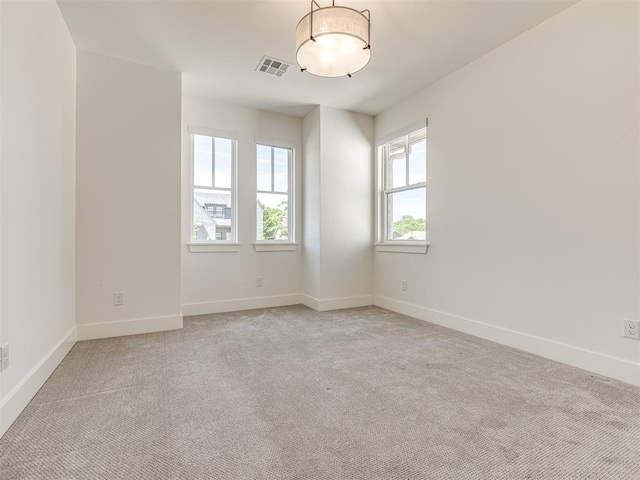 7308 Sunset Sail Ave, Edmond, OK 73034 - empty room featuring baseboards, light carpet, and visible vents