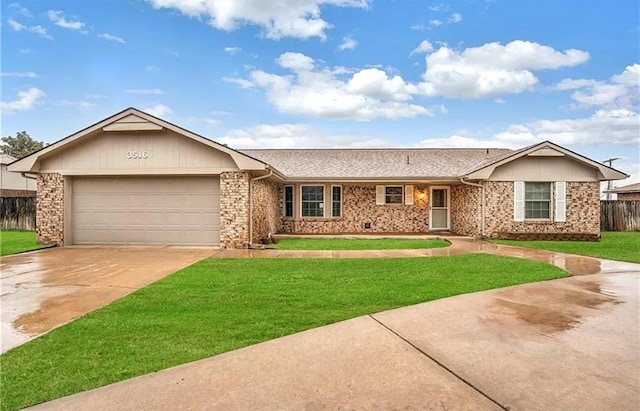 ranch-style home featuring a garage and a front yard