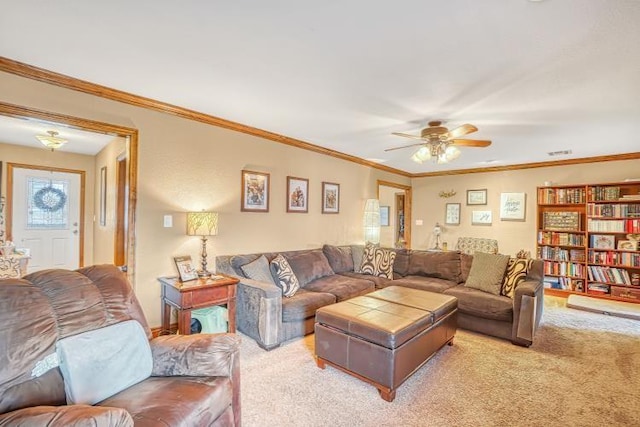 living room featuring crown molding, carpet floors, and ceiling fan