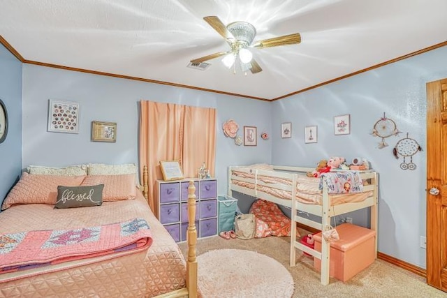 carpeted bedroom featuring crown molding and ceiling fan