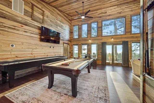 rec room with wood walls, wood ceiling, a high ceiling, and pool table