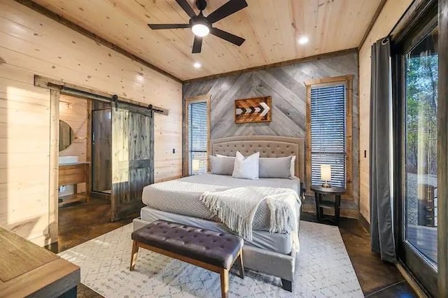 bedroom featuring a barn door, concrete floors, wooden ceiling, and wooden walls