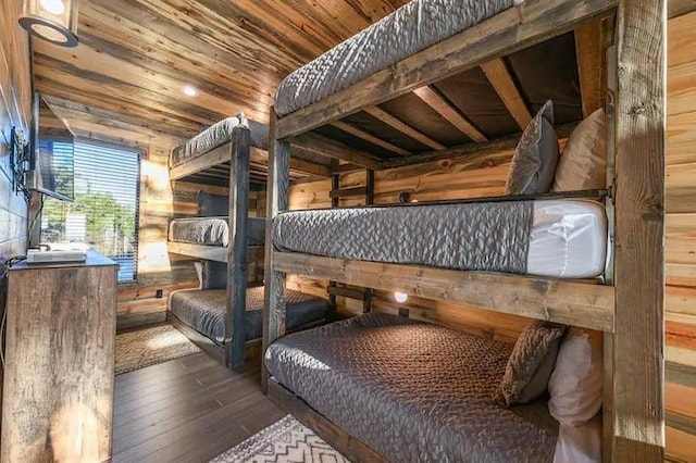 bedroom featuring wooden ceiling and wood finished floors