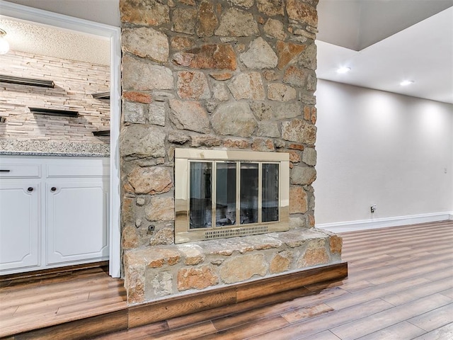 details with a fireplace and hardwood / wood-style floors