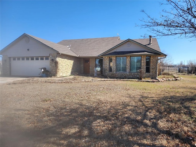 ranch-style home featuring a front lawn and a garage