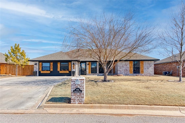 ranch-style home with a front yard