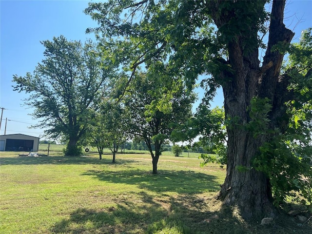 114 N Rambo St, Dill City, OK 73641 - view of grassy yard with a detached garage and an outdoor structure
