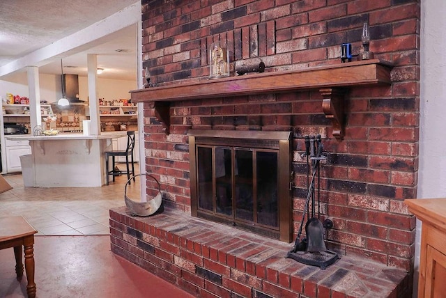 114 N Rambo St, Dill City, OK 73641 - detailed view of a brick fireplace, wall chimney exhaust hood, and concrete flooring