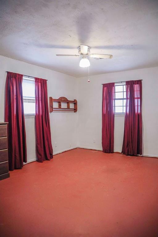 114 N Rambo St, Dill City, OK 73641 - carpeted spare room with a ceiling fan and baseboards