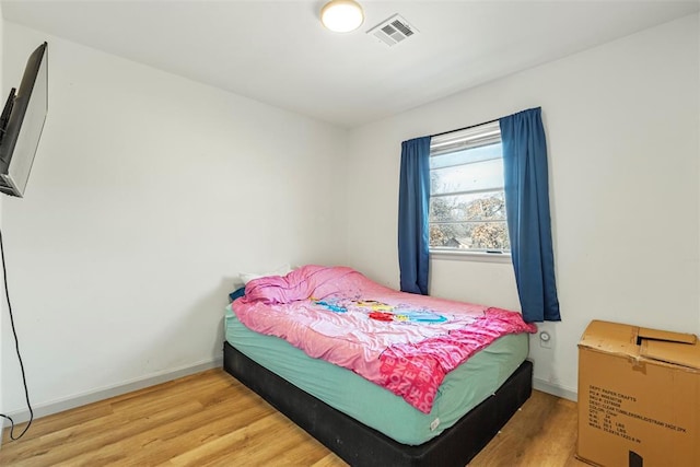 bedroom featuring hardwood / wood-style flooring