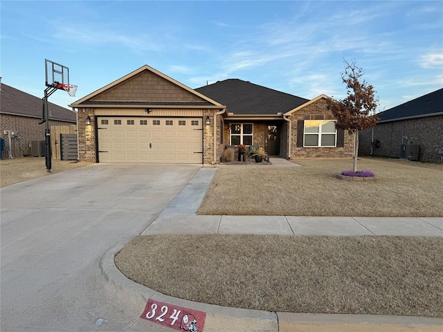 ranch-style home featuring a garage, central AC, and a front yard