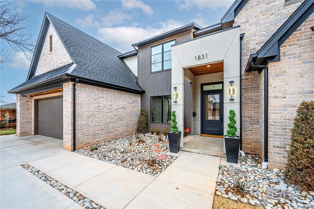 view of exterior entry featuring a garage