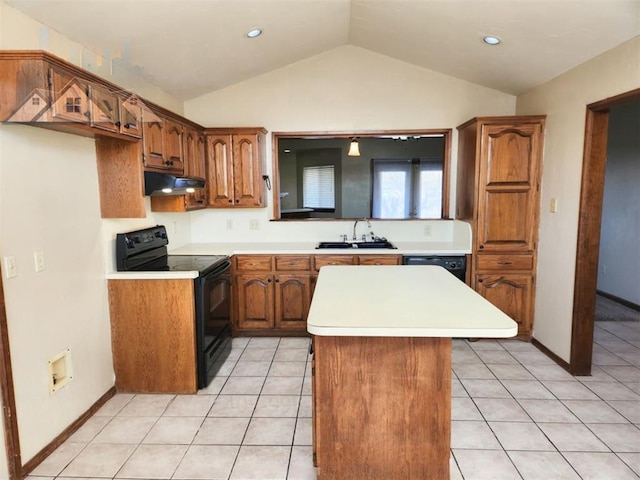 kitchen with brown cabinets, black appliances, under cabinet range hood, and light countertops