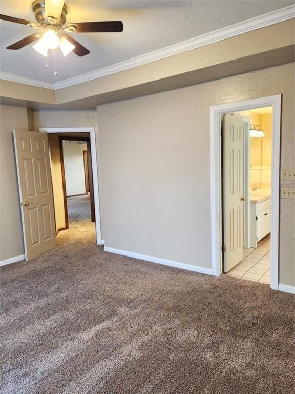 unfurnished room featuring light carpet, baseboards, ornamental molding, and a ceiling fan