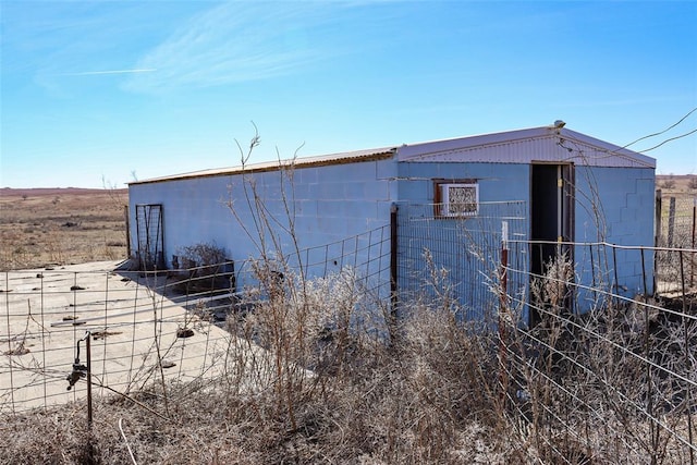 view of outdoor structure featuring fence