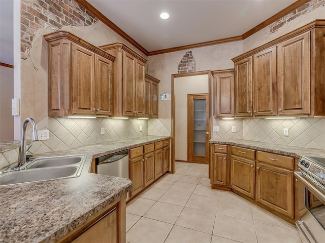 kitchen featuring light tile patterned floors, a sink, appliances with stainless steel finishes, brown cabinets, and crown molding