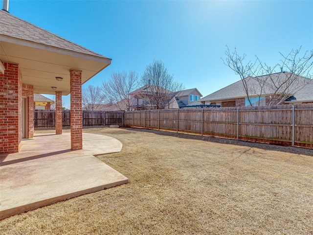 view of yard featuring a patio and a fenced backyard