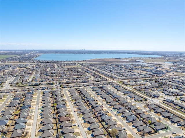 bird's eye view with a residential view and a water view