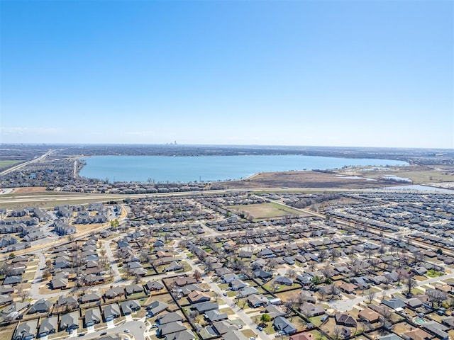 bird's eye view featuring a water view and a residential view