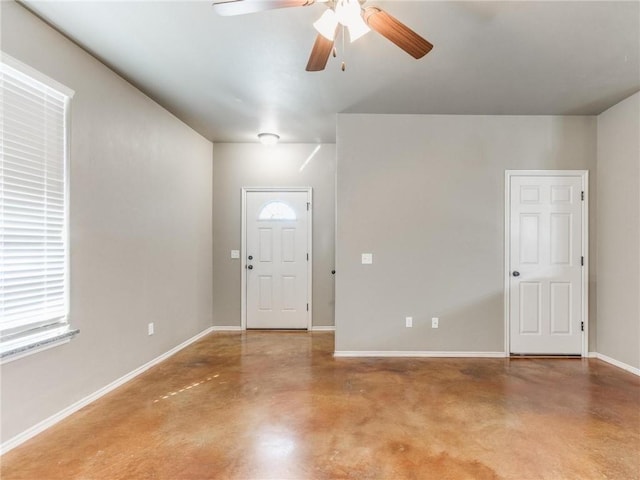 entryway with concrete flooring and ceiling fan