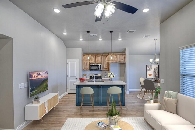 kitchen featuring visible vents, light wood finished floors, and stainless steel appliances