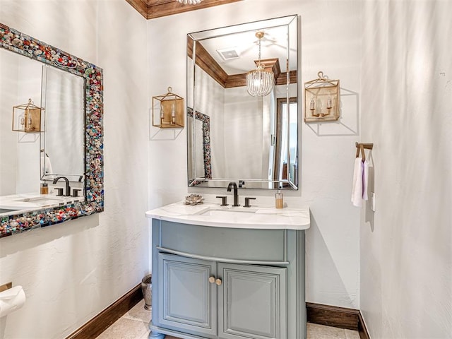 bathroom with vanity and baseboards