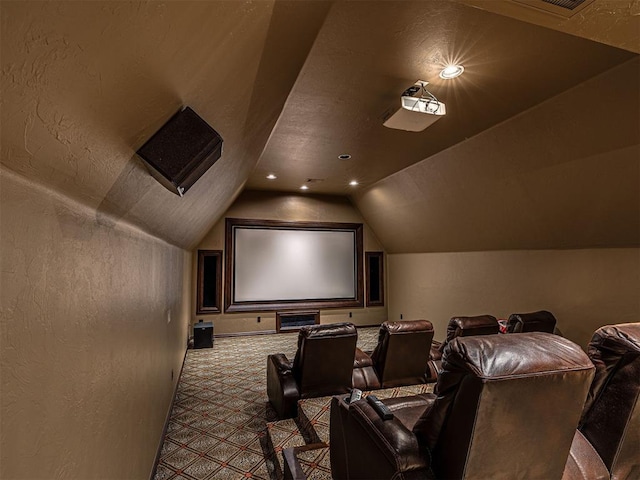 cinema with lofted ceiling, carpet, recessed lighting, and a textured wall