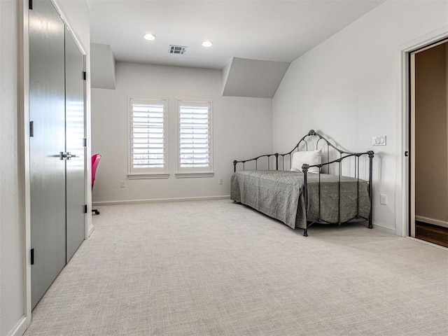 carpeted bedroom featuring baseboards, visible vents, and recessed lighting