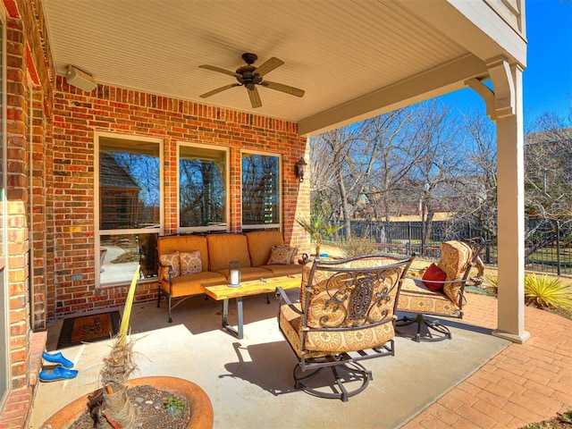 view of patio with ceiling fan, fence, and an outdoor living space