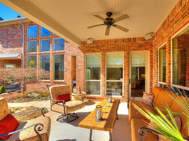 view of patio / terrace with an outdoor living space and a ceiling fan