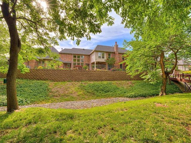 405 Flint Ridge Ct, Norman, OK 73072 - back of house with brick siding and a chimney