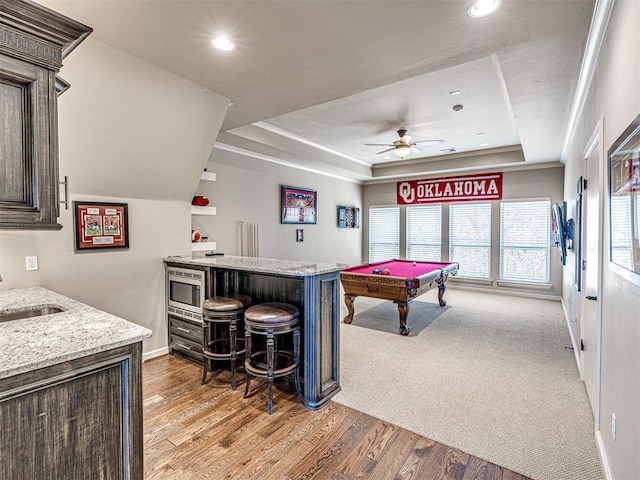 405 Flint Ridge Ct, Norman, OK 73072 - recreation room with a dry bar, a tray ceiling, baseboards, recessed lighting, and a ceiling fan