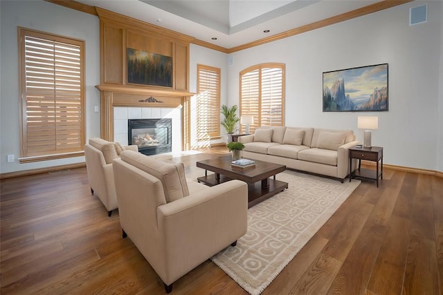 1601 Vandivort Pl, Edmond, OK 73034 - living area with wood finished floors, baseboards, a fireplace, crown molding, and recessed lighting