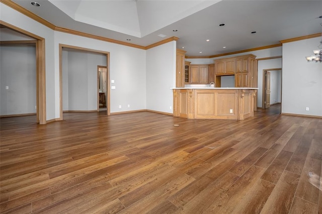 1601 Vandivort Pl, Edmond, OK 73034 - unfurnished living room with ornamental molding, wood finished floors, baseboards, a chandelier, and recessed lighting