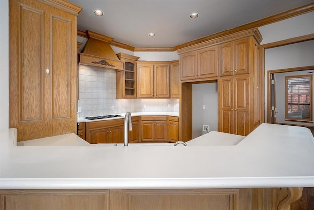 1601 Vandivort Pl, Edmond, OK 73034 - kitchen featuring glass insert cabinets, tasteful backsplash, light countertops, recessed lighting, and custom exhaust hood