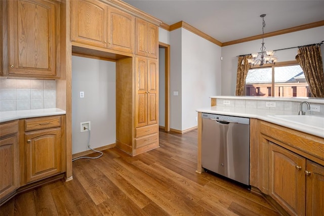 1601 Vandivort Pl, Edmond, OK 73034 - kitchen with dishwasher, a sink, a chandelier, tasteful backsplash, and dark wood-style flooring