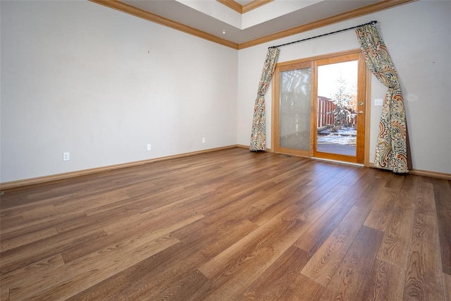 1601 Vandivort Pl, Edmond, OK 73034 - empty room with wood finished floors, baseboards, and ornamental molding