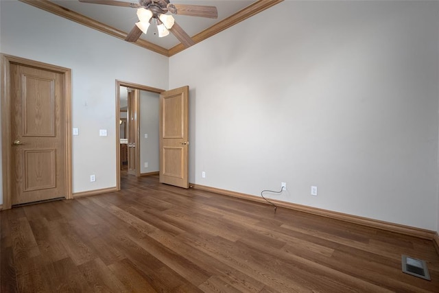 1601 Vandivort Pl, Edmond, OK 73034 - unfurnished bedroom with ornamental molding, baseboards, wood finished floors, and a ceiling fan