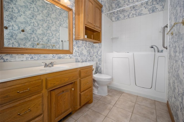 1601 Vandivort Pl, Edmond, OK 73034 - bathroom with wallpapered walls, tile patterned floors, vanity, a bathtub, and toilet