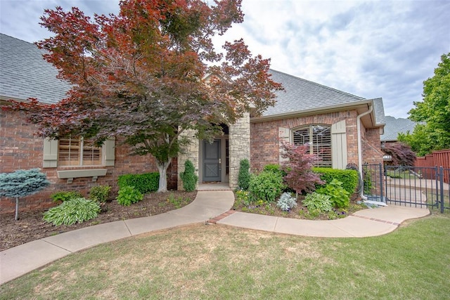 1601 Vandivort Pl, Edmond, OK 73034 - view of front of property featuring a shingled roof and brick siding